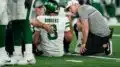 The curse of the Jets lives! Aaron Rodgers carted off field
